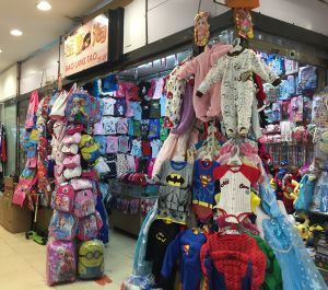 Stall selling kids costumes and bags Childrens costumes