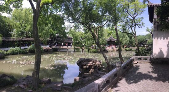 Humble Administrator's Garden has ponds and tea house. Pond with buildings