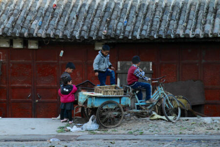 Kids playing around on old bike
