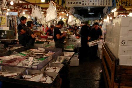 Crowded, narrow lanes between vendor stalls. Busy vendors in the market