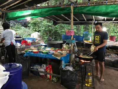 Our chefs cooking in the outdoor kitchen. Just like camping! Outdoor kitchen