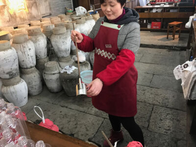 This nice lady was happy to offer me samples of their special wines Serving wind from the jugs