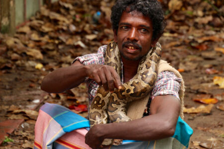 Snake charmer with his big boa constrictor. Kids got to touch and and hold it around their neck. Not me though, I noped the hell out of there. Boa constrictor