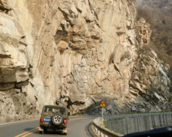 Riding along river in mountain pass
