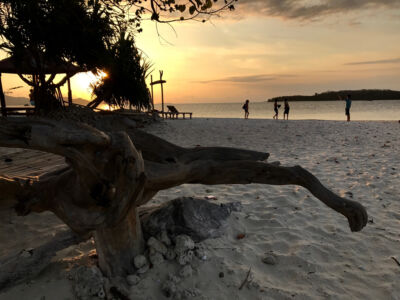 Kedis island at dusk. The island is a tiny retreat you can circumnavigate in less than five minutes. Kedis island, Indonesia