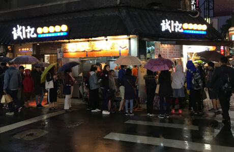 The line waiting for pancakes People waiting in line for street snack