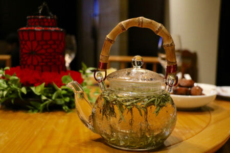 Longjing Tea clear teapot with tea leaves