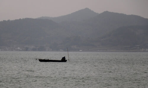 Fisherman on Dongqian Lake Dongqian Lake, Ningbo
