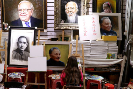 Deng Xiaoping looks on as a sweet girl paints her first masterpiece. Girl painting something