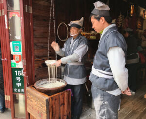 This guy was singing and drawing out the potato noodles. Singing and making noodles