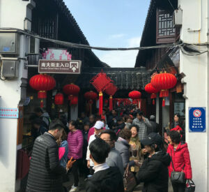 Afternoon on a Tuesday yet still crowded. Crowded street in Qibao