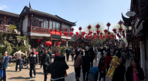 The narrow street opens up a bit but it gets narrow again open area in Qibao street