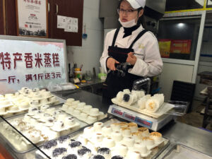 Steamed rice cakes topped with flavors such as sesame, pork, dates,.. Steamed rice cakes