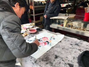 Old man painting watercolor