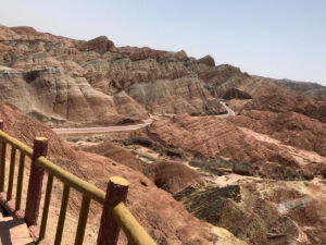 Bus road cutting through the Rainbow Mountains Bus path in Rainbow Mountains